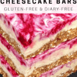 pink raspberry cheesecake bars sitting on plate