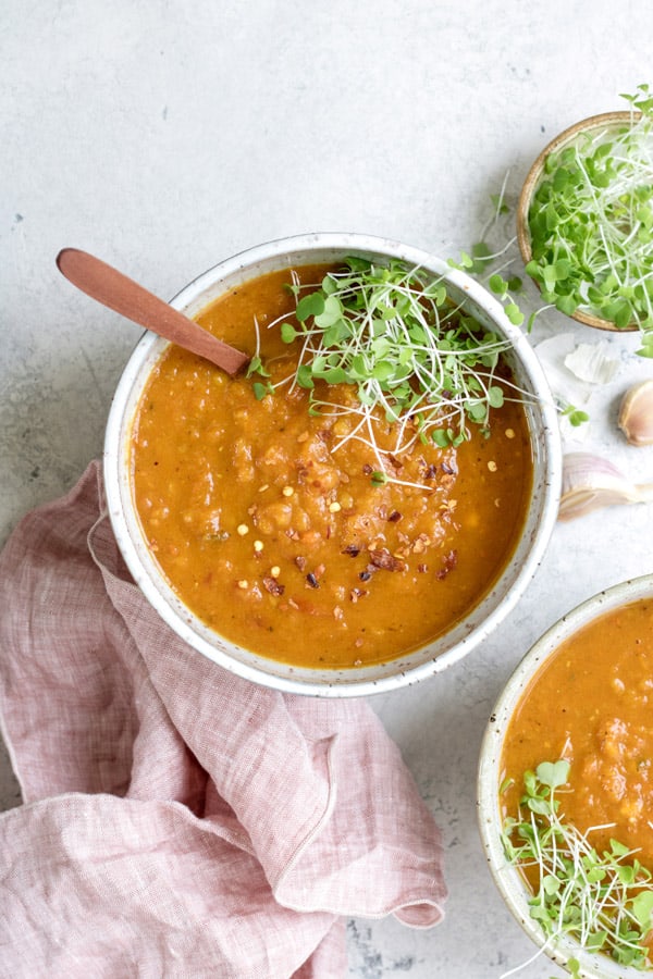 This spiced carrot, lentil, and sweet potato soup is a satisfying healthy soup that is filled with warming flavours of ginger and turmeric. It's like a hug in a bowl!