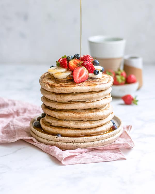 gluten free buckwheat pancakes with syrup on top