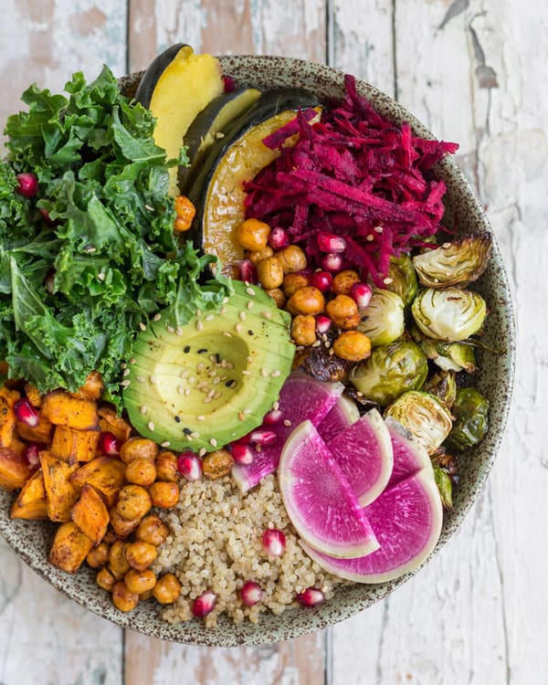 This healthy vegan fall harvest buddha bowl recipe is loaded with nourishing ingredients like sweet potato and chickpeas! Enjoy this healthy bowl for lunch or dinner!