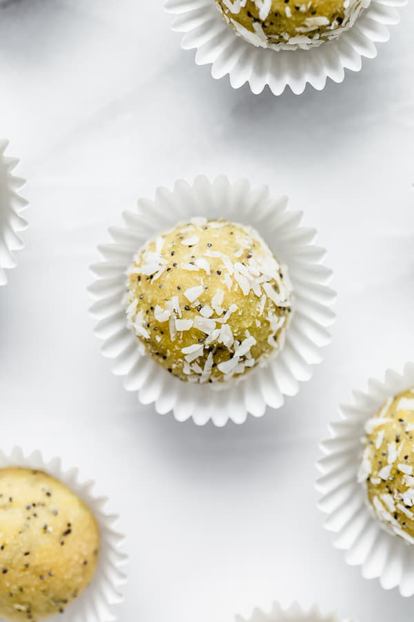 lemon poppyseed energy bites on a marble board