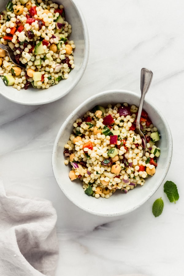 two bowls of Israeli couscous salad