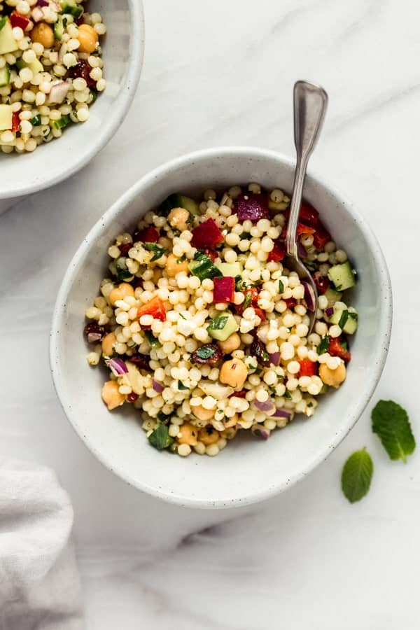 A bowl with Israeli couscous salad