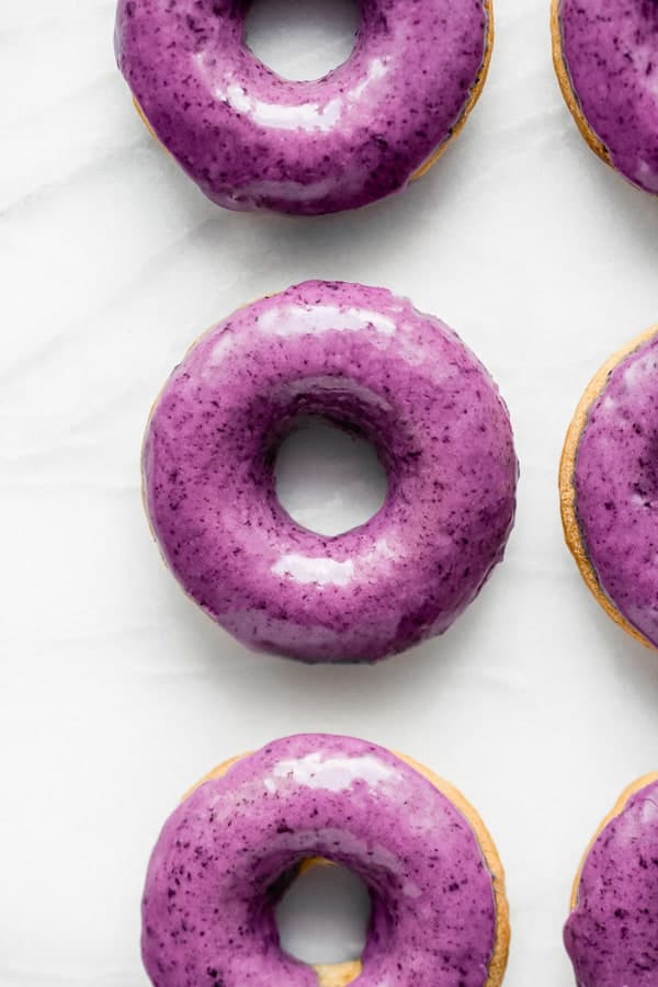 blueberry donuts on a marble board 