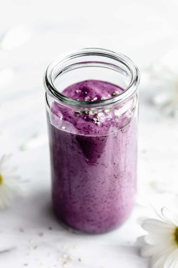 a blueberry avocado smoothie in a jar