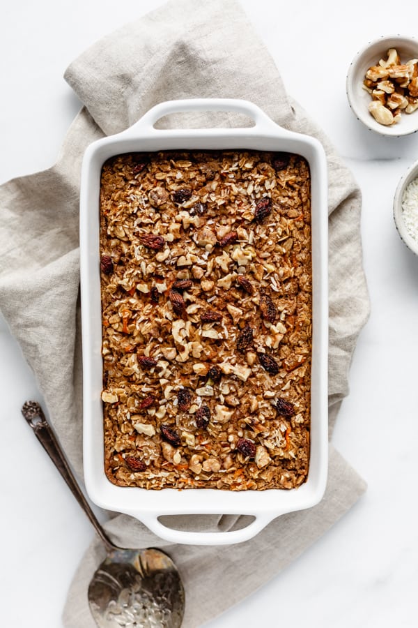 carrot cake baked oatmeal in a baking dish on a napkin