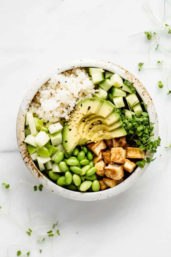 tofu rice and vegetables in a while ceramic bowl