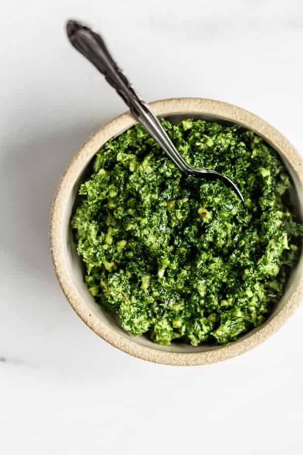 a small bowl with kale pesto in it 