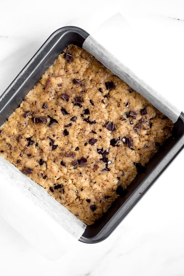 uncooked paleo tahini blondies in an 8x8 inch pan