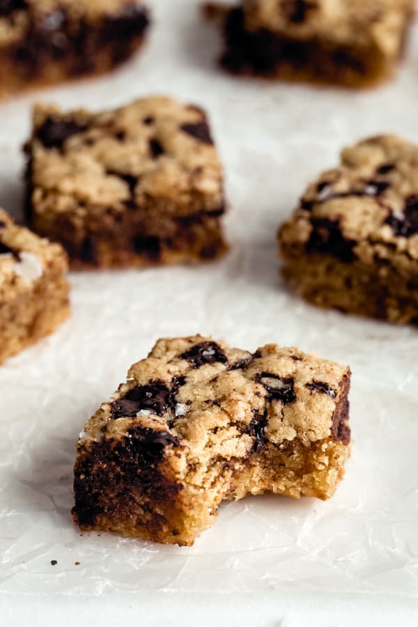 a paleo tahini blondie with a bite taken out of it