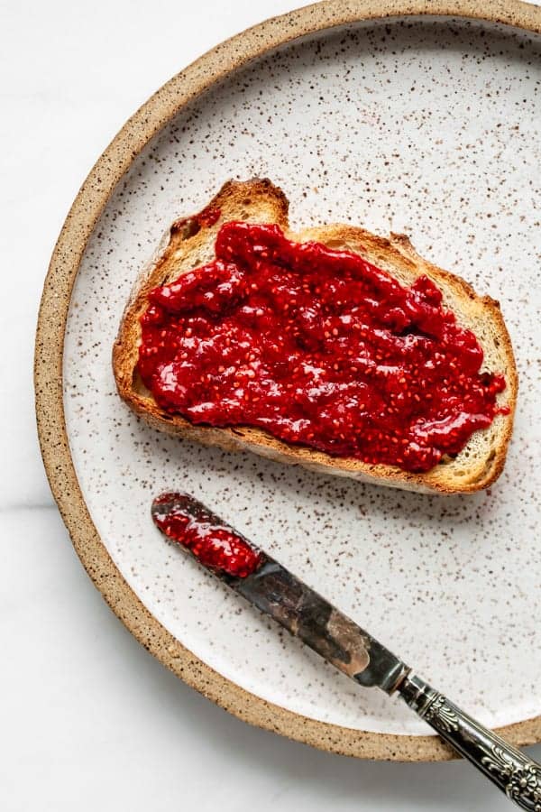 a piece of toast with chia seed jam on it