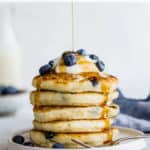 a stack of vegan pancakes with blueberries