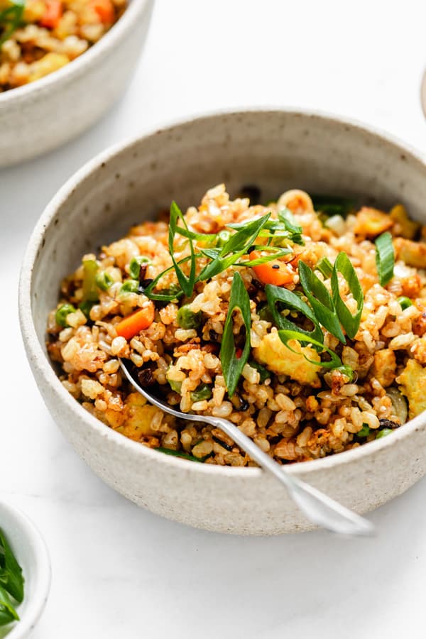vegan fried rice in a bowl with a spoon