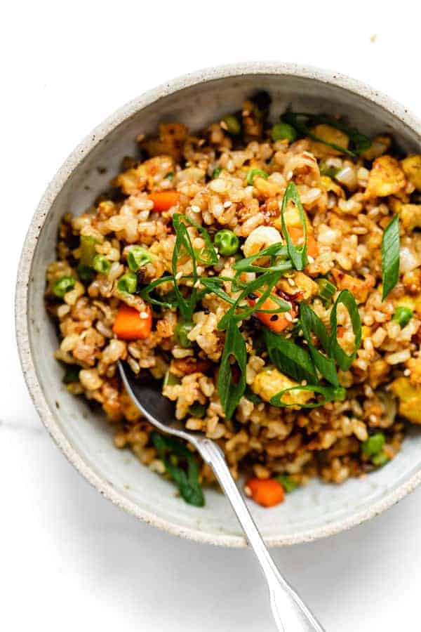 top down image of vegan fried rice with sliced green onions on top
