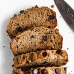 chocolate chip zucchini bread cut up on a marble board