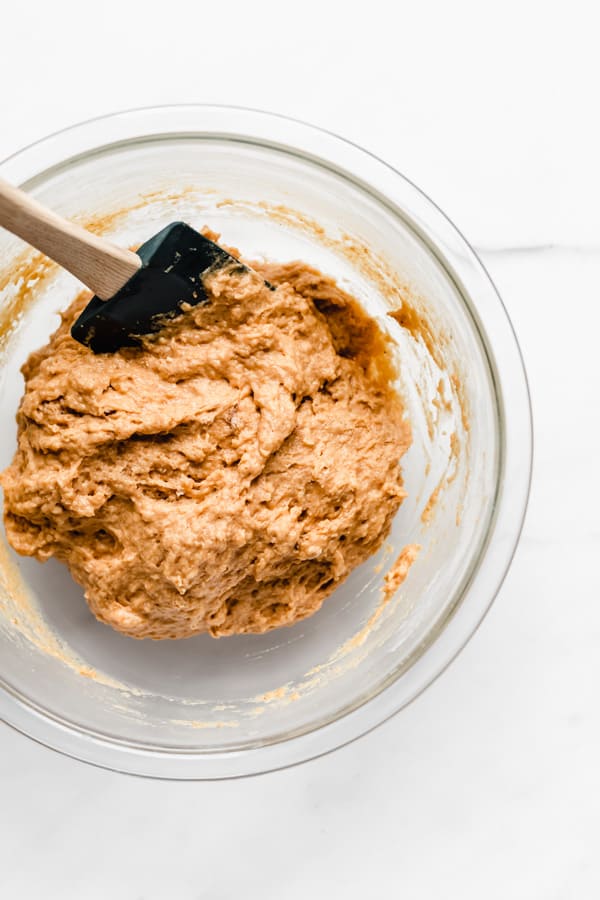 pumpkin muffins batter in a clear mixing bowl