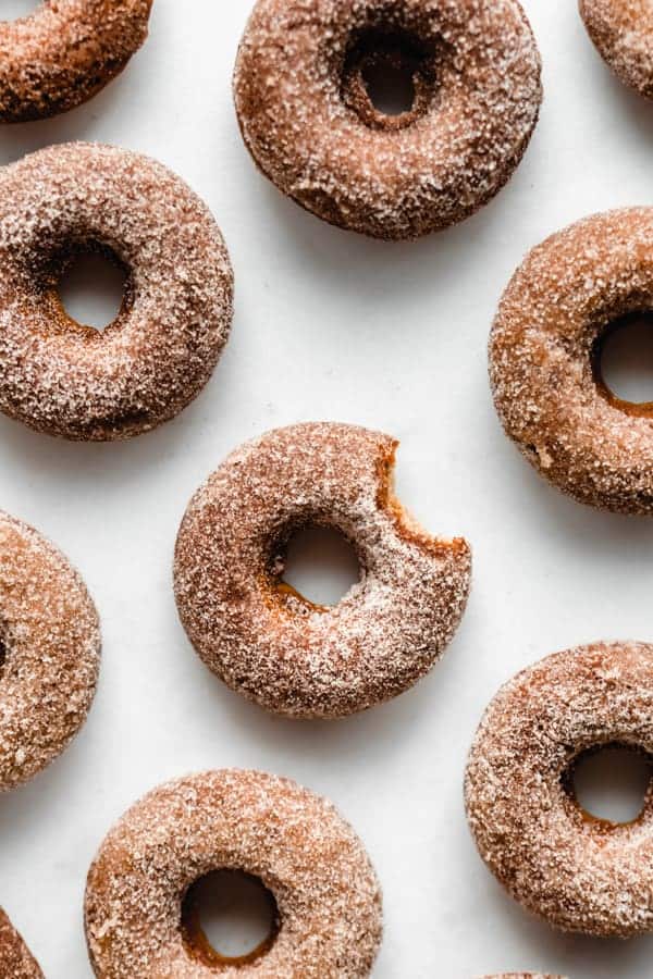 vegan apple cider donuts on a marble board