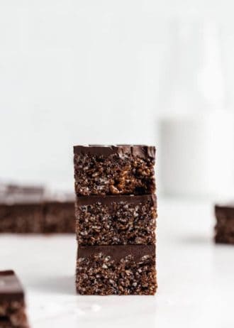 three chocolate rice Krispie treats stacked on top of each other