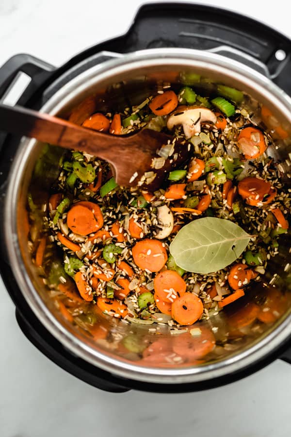 an instant pot with veggies and rice in it