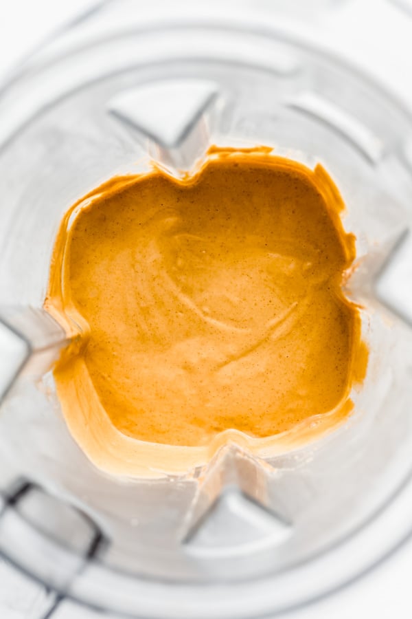 a blender with pumpkin mousse in it