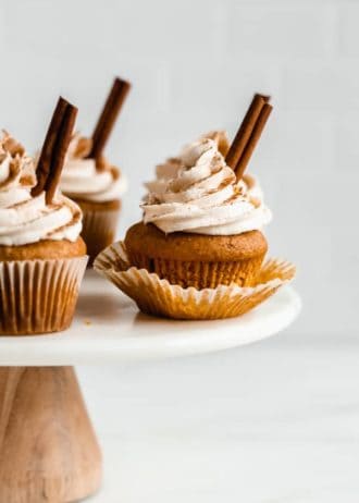 pumpkin spice latte cupcakes on a marble cake stand