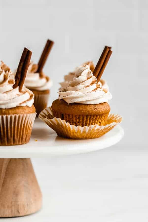 pumpkin spice latte cupcakes on a marble cake stand