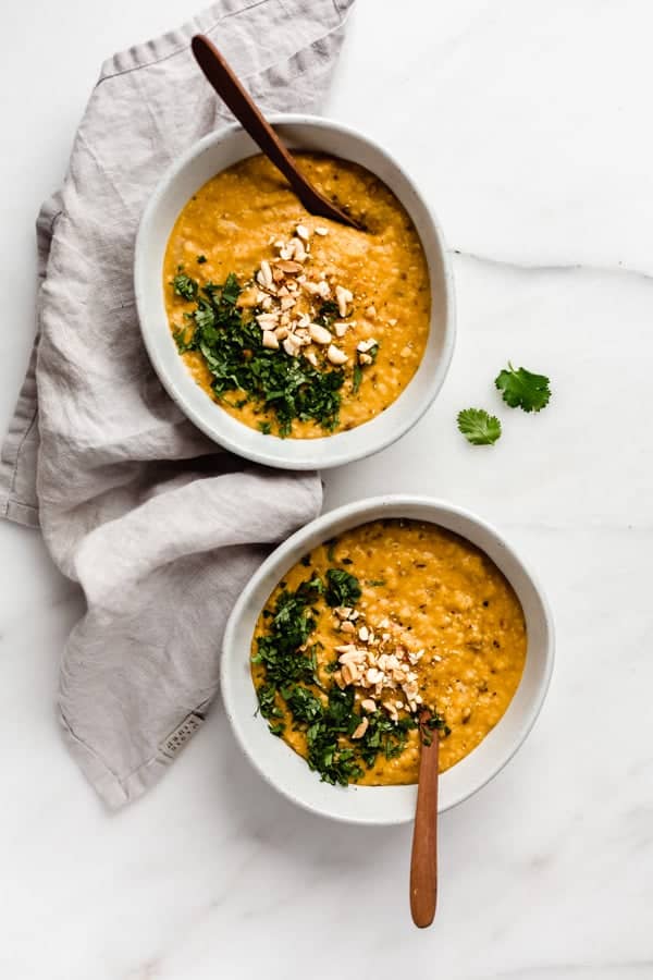two bowls of Sri Lankan style dal with a napkin on the side
