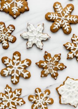 snowflake gingerbread cookies on a marble board