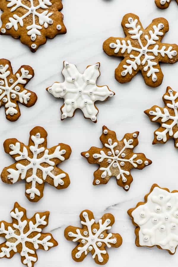 snowflake gingerbread cookies on a marble board