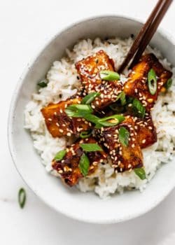 rice and orange tofu in a bowl