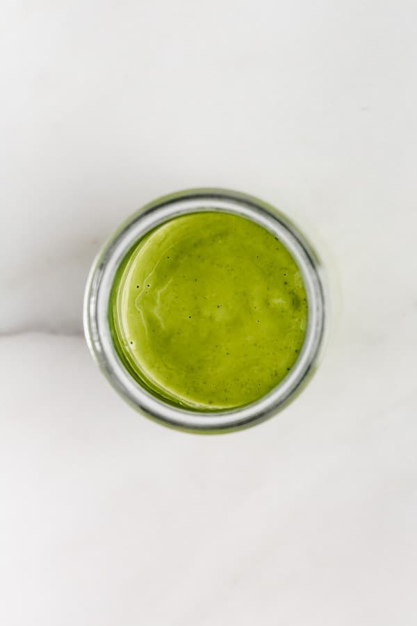 Top down view of Green Goddess Dressing in a jar