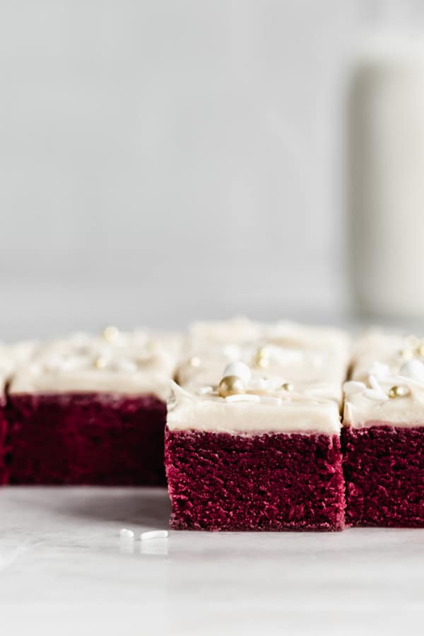 Red velvet brownies with icing cut into squares