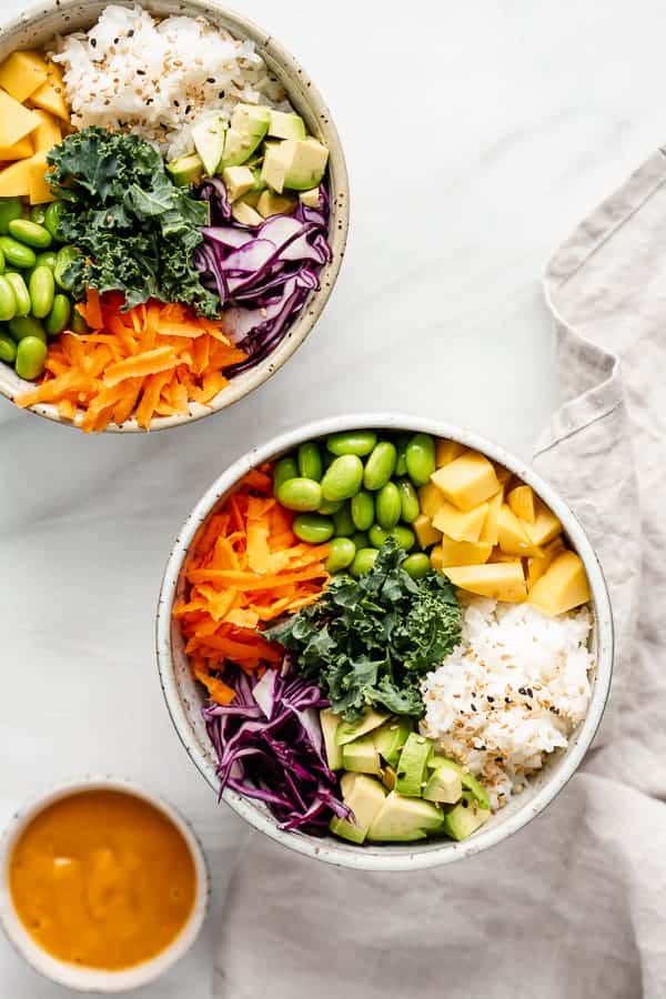 A vegan buddha bowl with mango, rice and vegetables