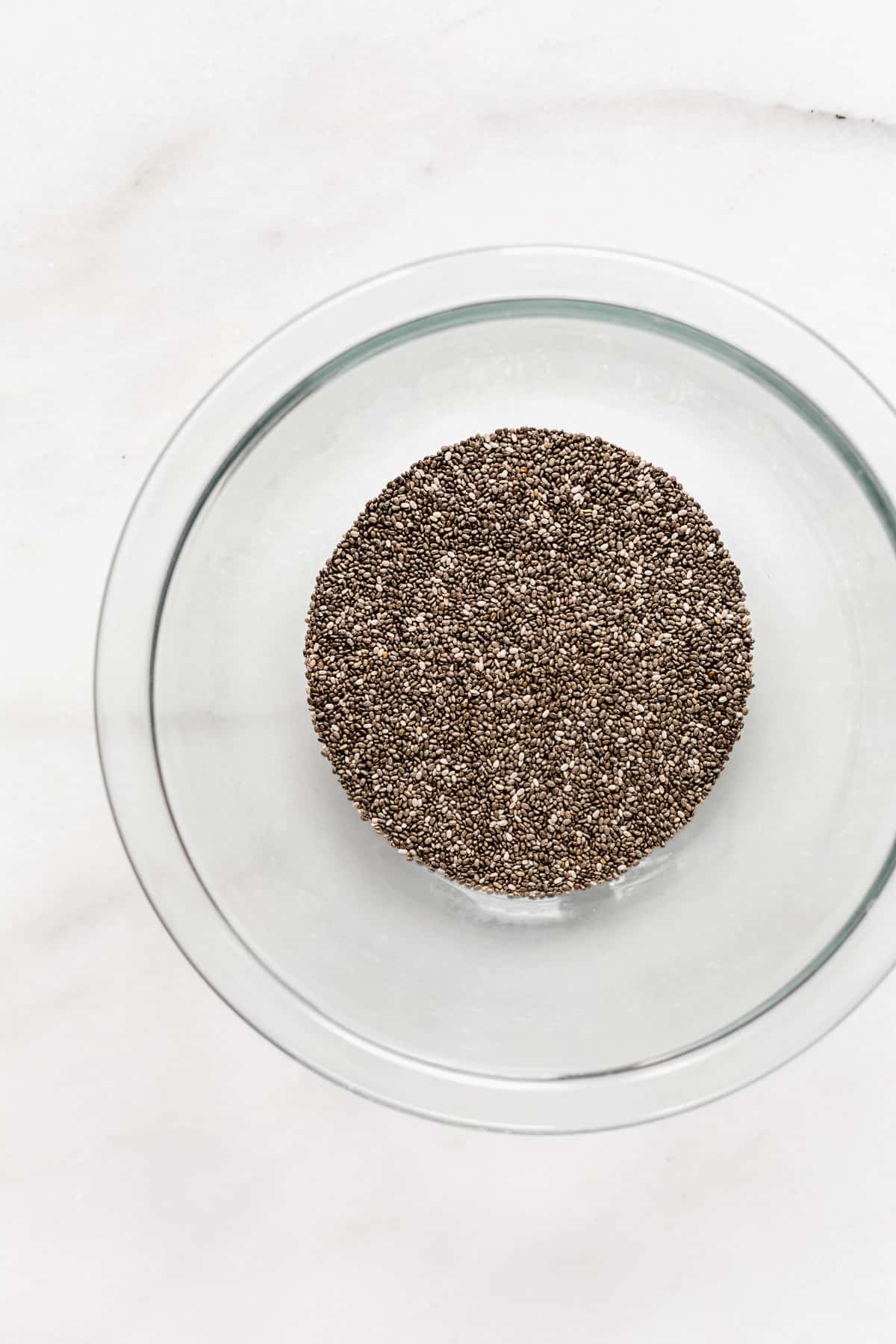 chia seeds in a clear mixing bowl