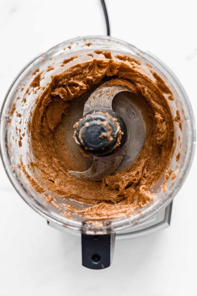 a food processor with date caramel in it