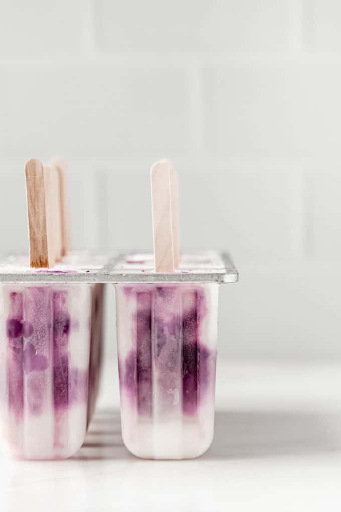 blueberry greek yogurt popsicles in a popsicle mould