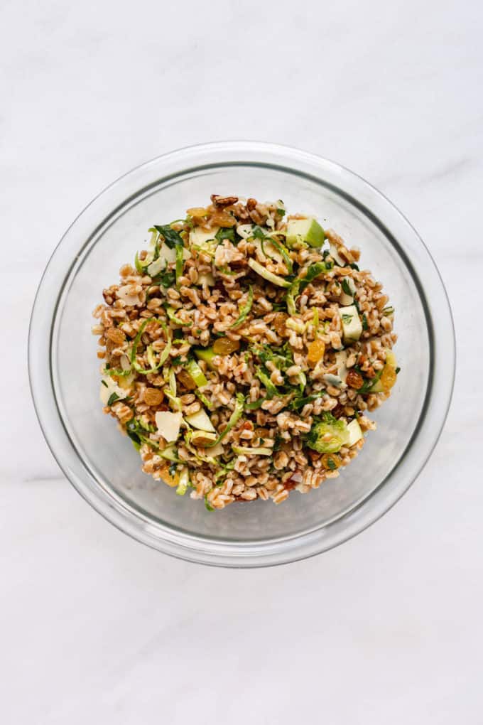 farro salad in a clear mixing bowl