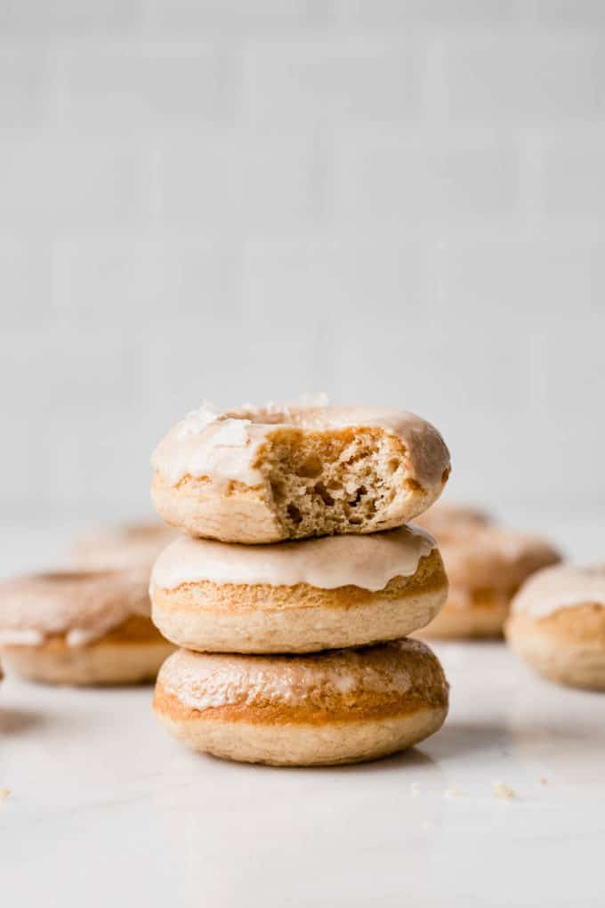 a stack of three maple donuts