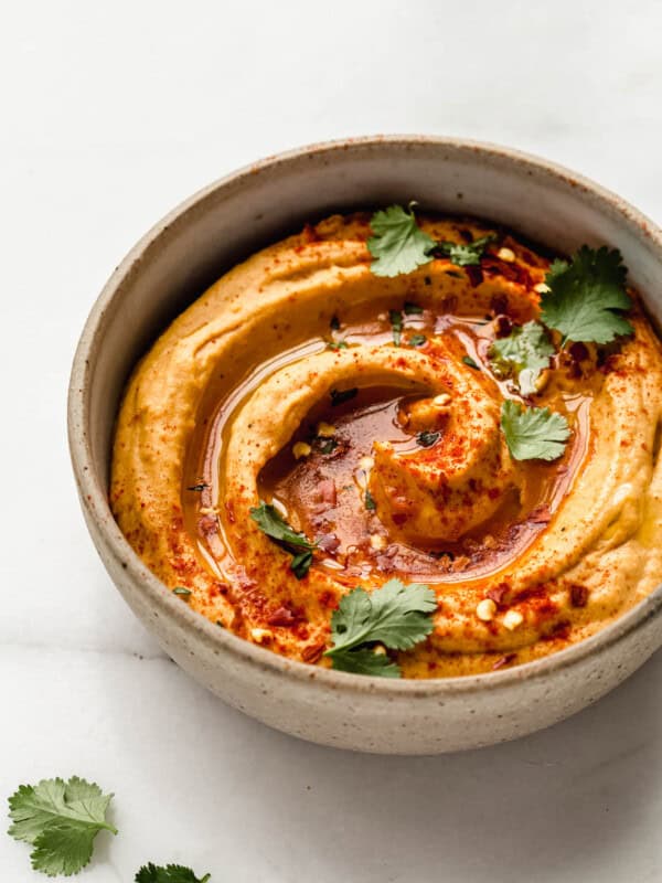 sweet potato hummus in a speckled ceramic bowl