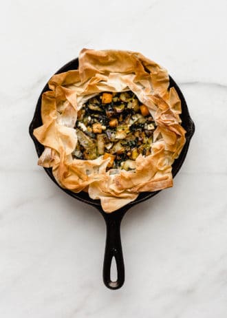 A veggie skillet phyllo pie baked in a cast iron skillet