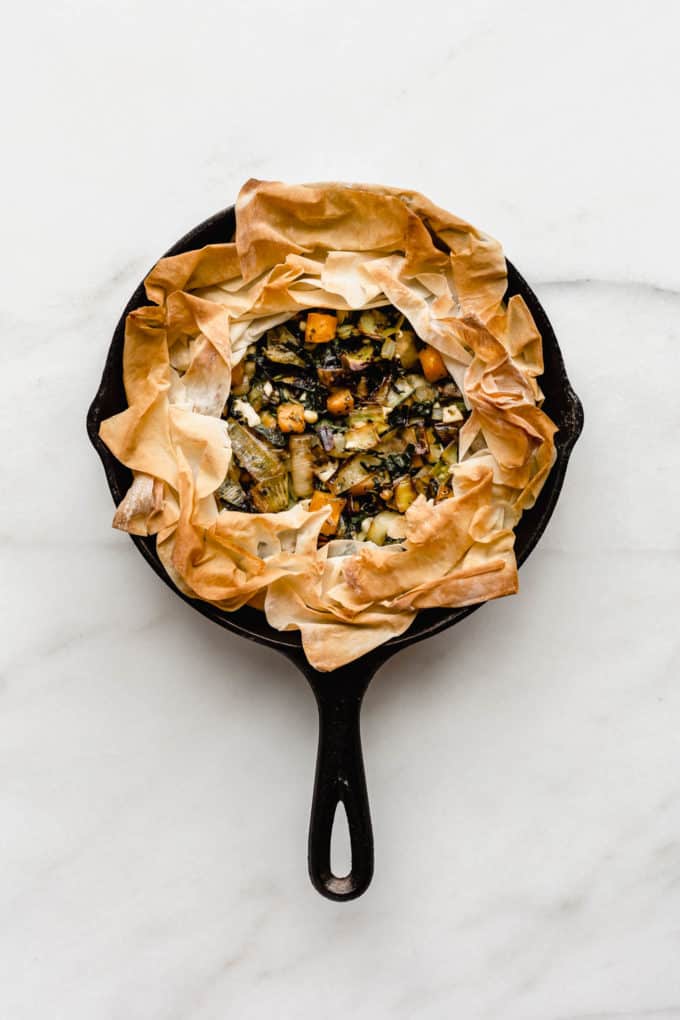 A veggie skillet phyllo pie baked in a cast iron skillet