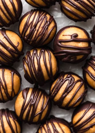 peanut butter balls drizzled with dark chocolate