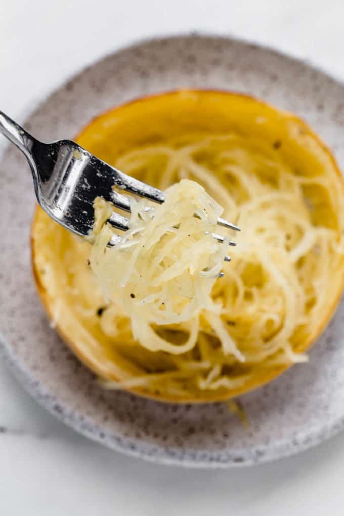 a fork scooping some spaghetti squash