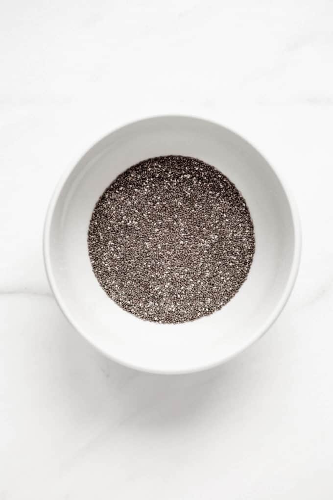A white bowl with chia seeds in it