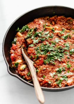 A close up of vegan shakshuka topped with parsley