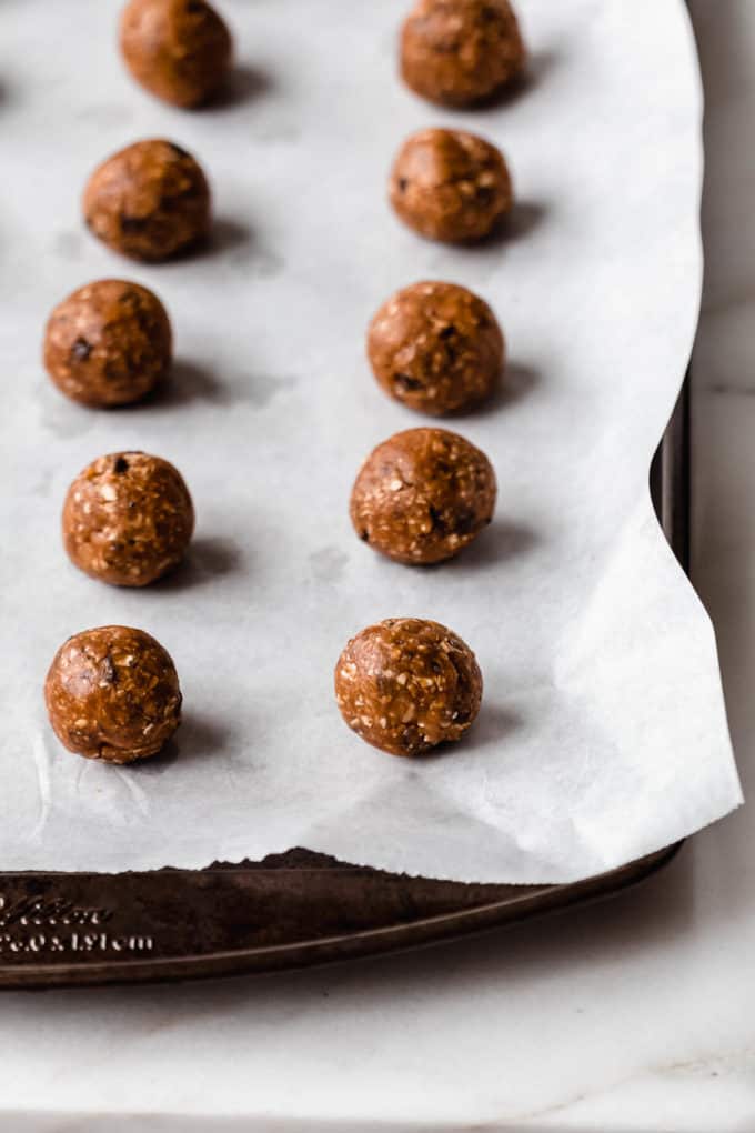 A baking sheet with protein balls on it