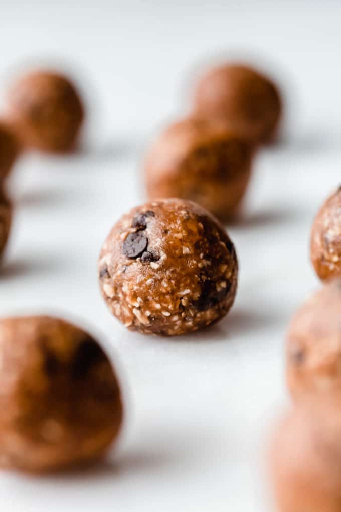 A peanut butter protein ball on a marble board