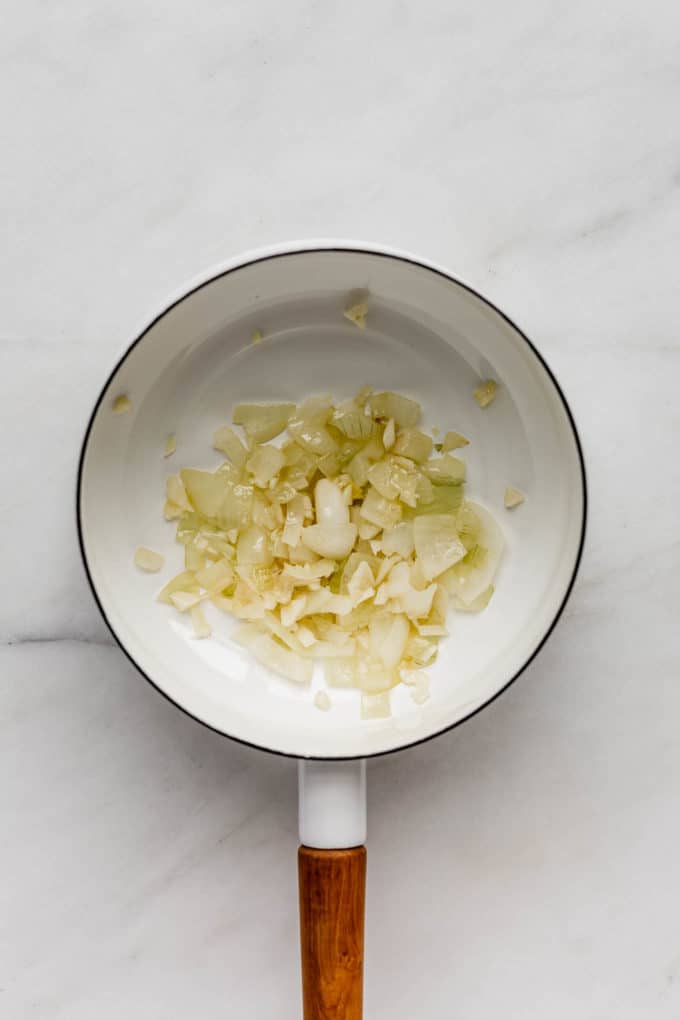sautéed onions in a white pot