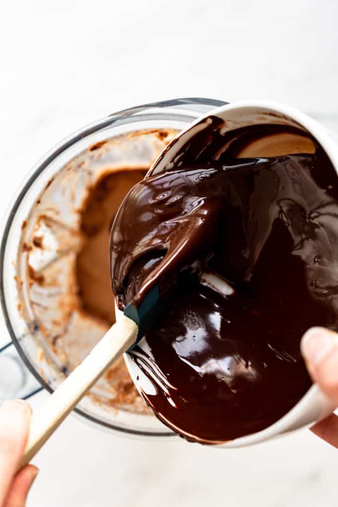 Dark chocolate being poured into a blender