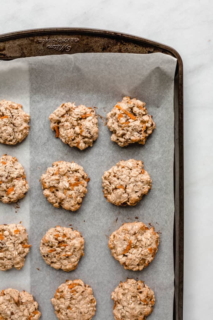 baked healthy carrot cake cookies on a baking sheet